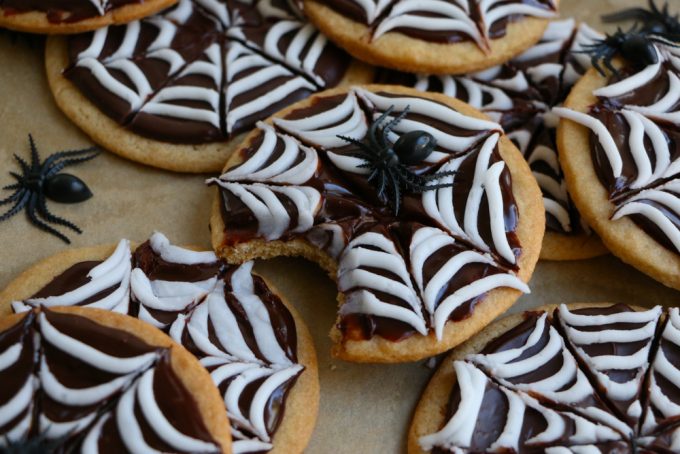 Spider Web Sugar Cookies made with whole wheat flour! These cookies have a silky and smooth chocolate ganache and white icing! Perfect for a Halloween party!