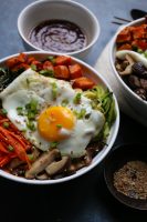 Fall inspired Vegetarian Bibimbap with roasted sweet potatoes, sautéed kale, zucchini, carrots and shiitake mushrooms! I love a delicious bowl of Korean bibimbap and this is my vegetarian spin! 