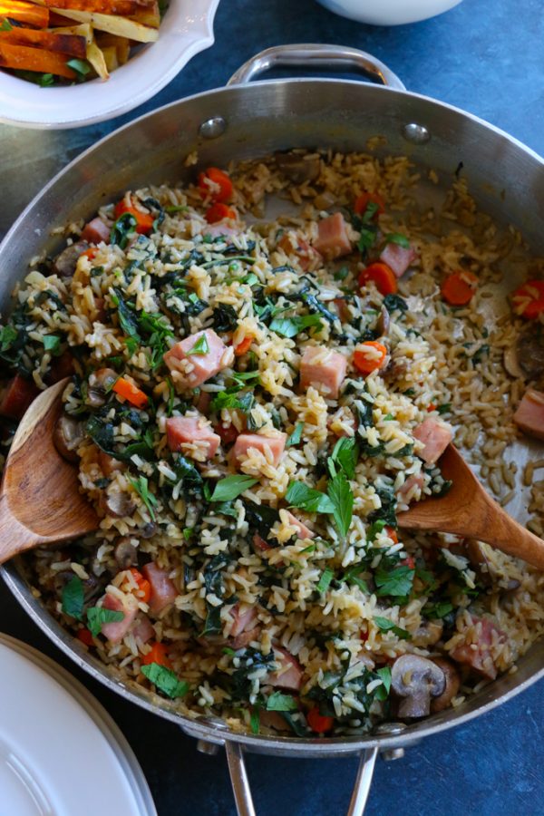 Asiago Cheese and Cracked Black Pepper Rice with Ham. Packed with mushrooms, carrots, kale and ham, this dish is so delicious and the perfect way to revamp your holiday leftovers!