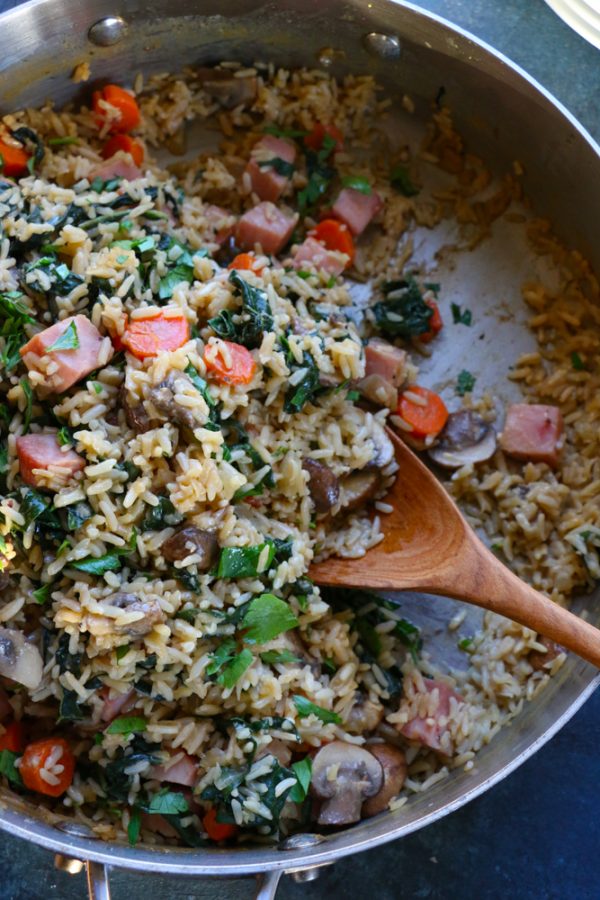 Asiago Cheese and Cracked Black Pepper Rice with Ham. Packed with mushrooms, carrots, kale and ham, this dish is so delicious and the perfect way to revamp your holiday leftovers!