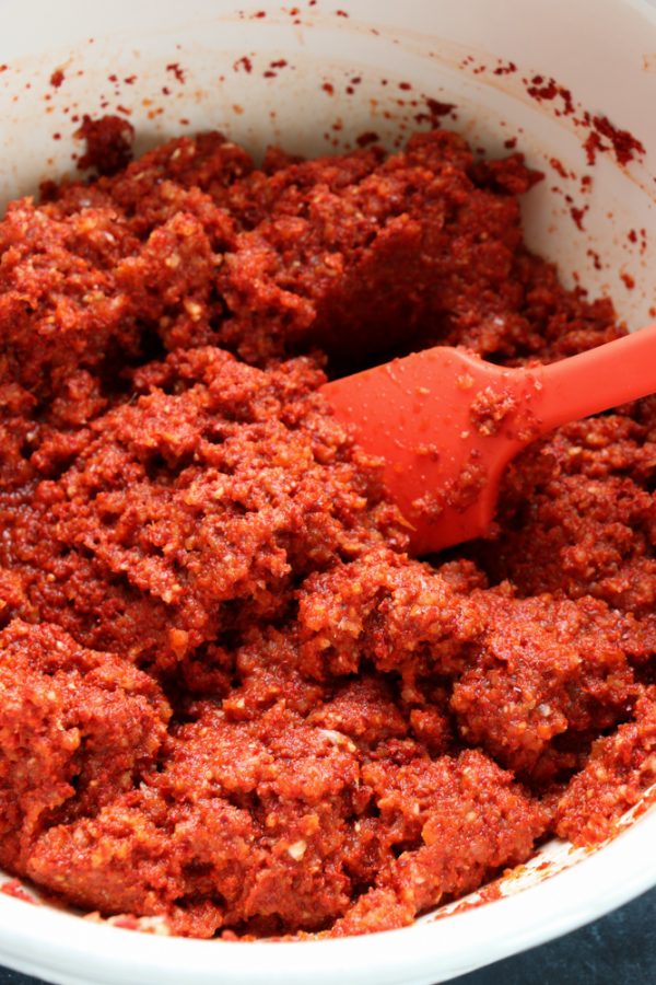 combining ingredients in a large bowl to make kimchi paste