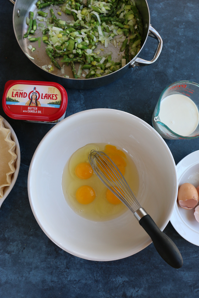 A delicious and flavorful asparagus and leek quiche made with an all butter pie dough! This is the perfect brunch to make for mom on Mother&rsquo;s Day!