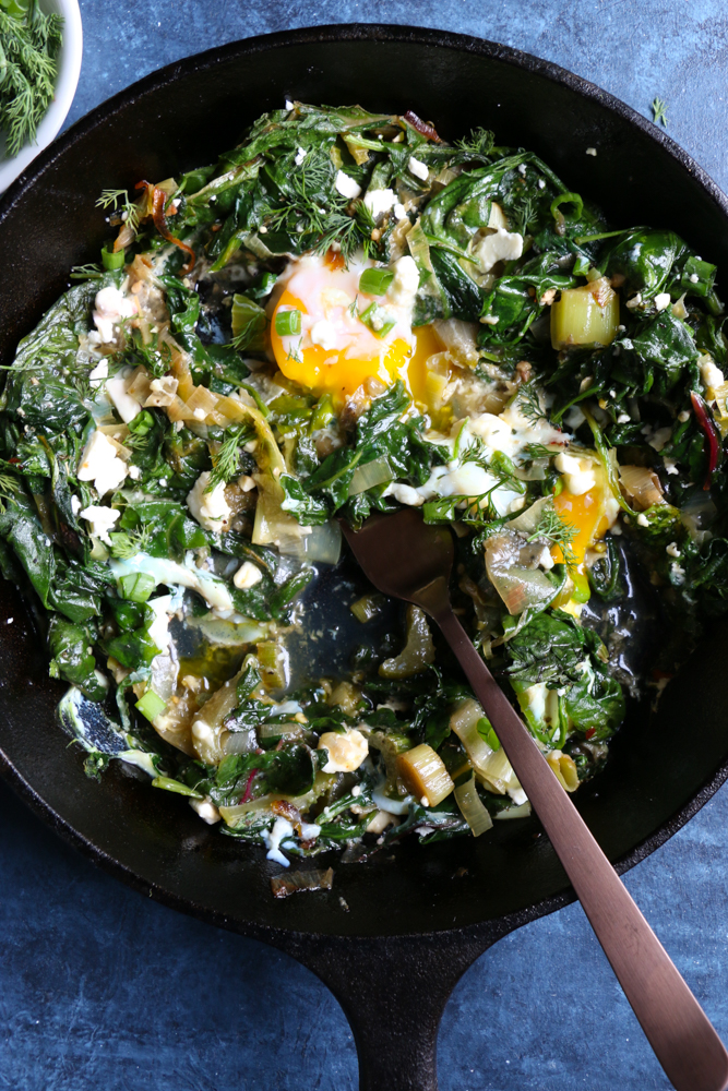 Green Shakshuka! Inspired by my recent trip to La Crosse, Wisconsin, this is a play on traditional shakshuka. This flavorful, bright green dish is made with leeks, Swiss chard, spinach, celery and more! You are going to love this!&nbsp;