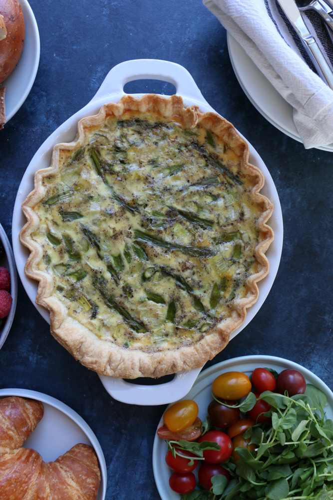 A delicious and flavorful asparagus and leek quiche made with an all butter pie dough! This is the perfect brunch to make for mom on Mother&rsquo;s Day!