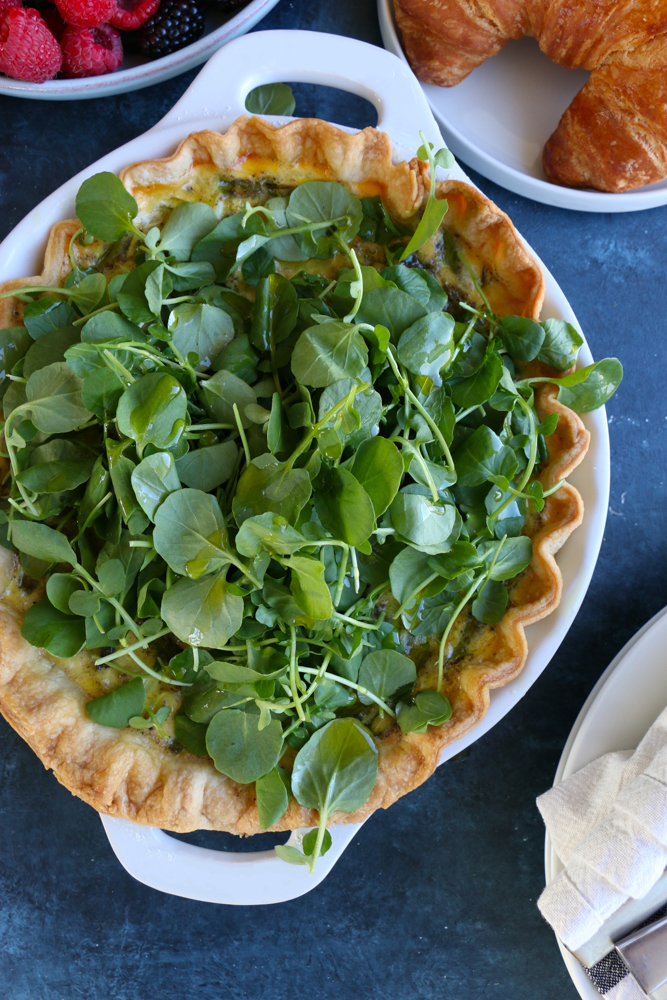 A delicious and flavorful asparagus and leek quiche made with an all butter pie dough! This is the perfect brunch to make for mom on Mother&rsquo;s Day!