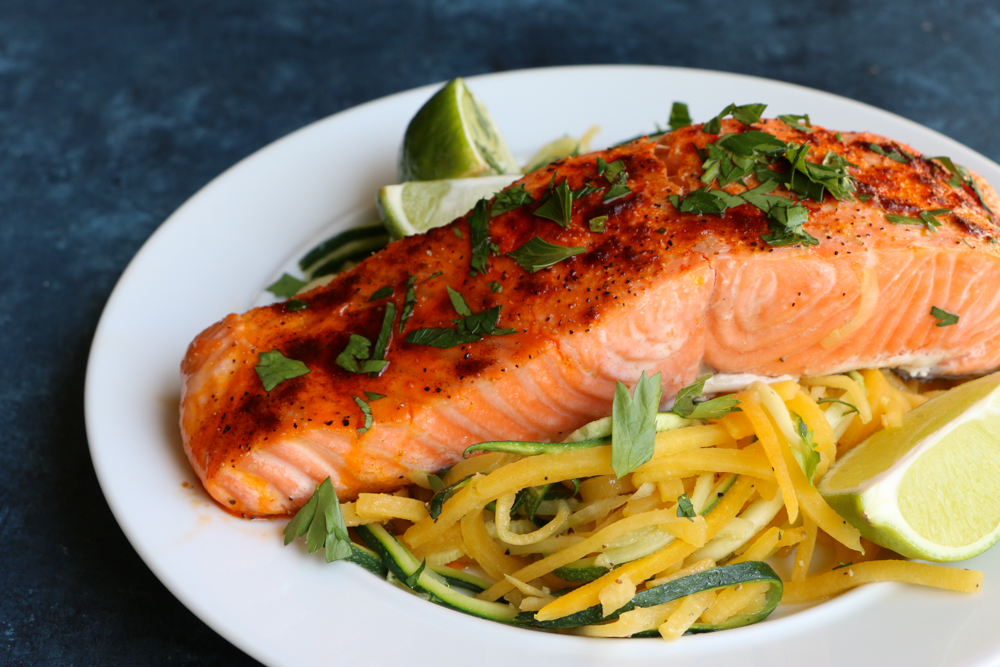 Baked Salmon with Spiralized Veggies! This is one of my go-to meals because it's so easy, quick and delicious!&nbsp;Rich in Omega-3 Fatty Acids and a great source of protein, you should definitely go pick up some salmon today!