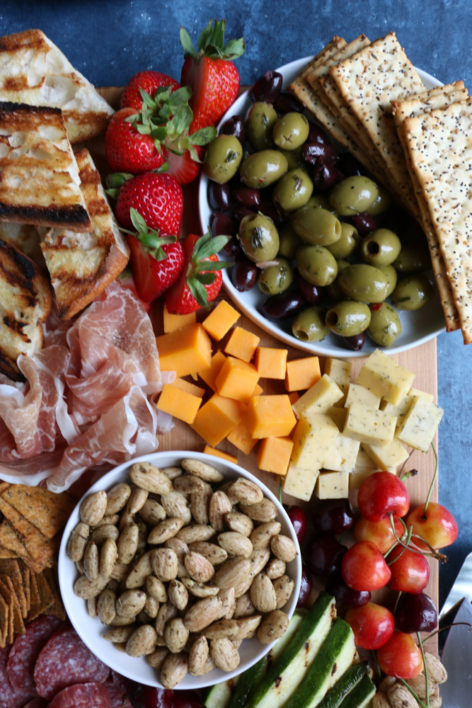 My Summer Cheese and Charcuterie Board with Blue Diamond Crafted Gourmet Garlic Herb and Olive Oil almonds! Summer entertaining is not complete without a cheese and charcuterie board like this!