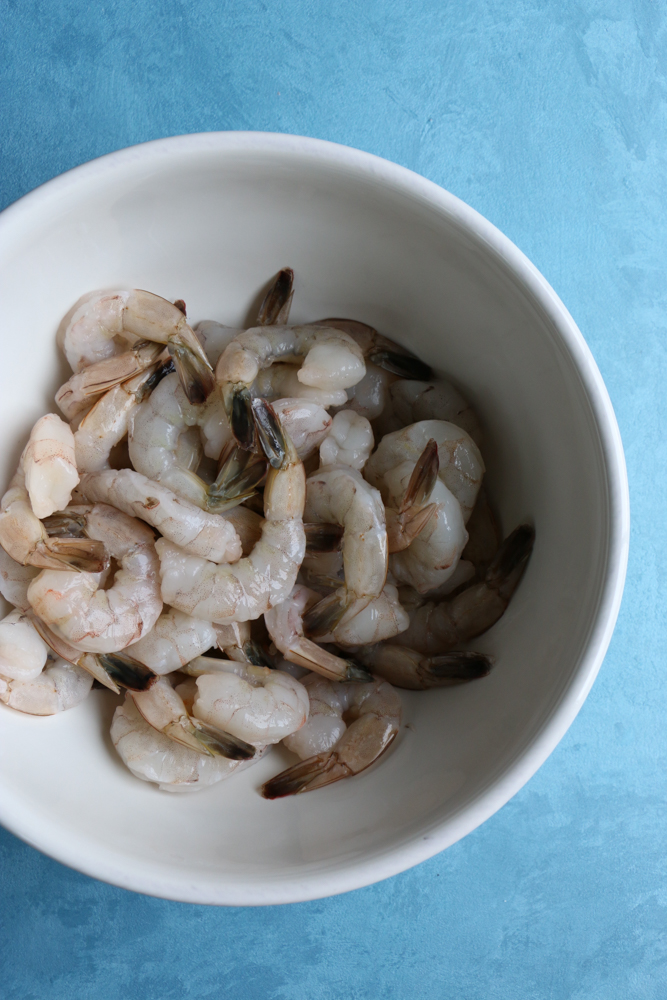 Coconut Shrimp Curry served over jasmine rice. Flavorful, delicious and with just the right amount of heat. You can also use this for chicken or veggies! You are going to love this!