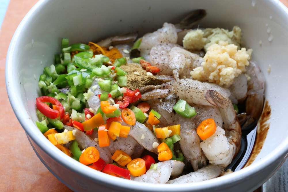 Coconut Shrimp Curry served over jasmine rice. Flavorful, delicious and with just the right amount of heat. You can also use this for chicken or veggies! You are going to love this!