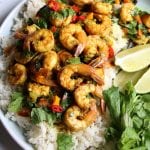 Coconut Shrimp Curry served over jasmine rice. Flavorful, delicious and with just the right amount of heat. You can also use this for chicken or veggies! You are going to love this!