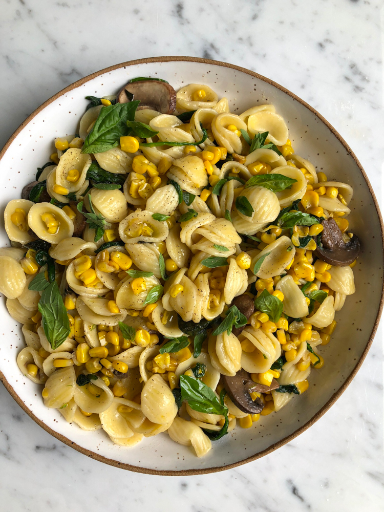 Orecchiette With Corn and Spinach!! Whether you are using up your last sweet summer corn or using frozen corn, this simple, easy and absolutely delicious pasta comes together in no time at all!&nbsp;