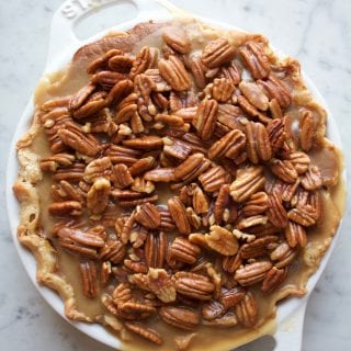 Pecan Apple Pumpkin Pie! The ultimate Thanksgiving pie with a layer of spiced apples, pumpkin pie filling and caramelized pecans on top!