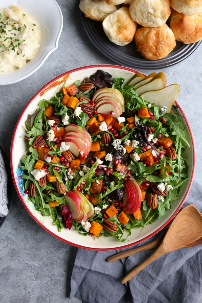 Autumn Salad with Seasoned Roasted Butternut Squash! Fresh mixed greens and arugula, apples, pears, toasted pecans and the seasoned roasted butternut squash, this is fall in a salad! You need this salad on your Thanksgiving Day table!