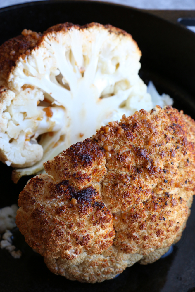 Whole Roasted Cauliflower with a light, spicy Asian dressing. Forget the side dish, this could be the star of your dinner table! This is incredible!&nbsp;
