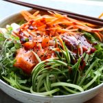 Sashimi Salad Bowl! Sliced sashimi over a bed of lettuce with fresh cucumbers, carrots, thinly sliced apples and a spicy gochujang sauce!