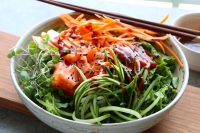 Sashimi Salad Bowl! Sliced sashimi over a bed of lettuce with fresh cucumbers, carrots, thinly sliced apples and a spicy gochujang sauce!