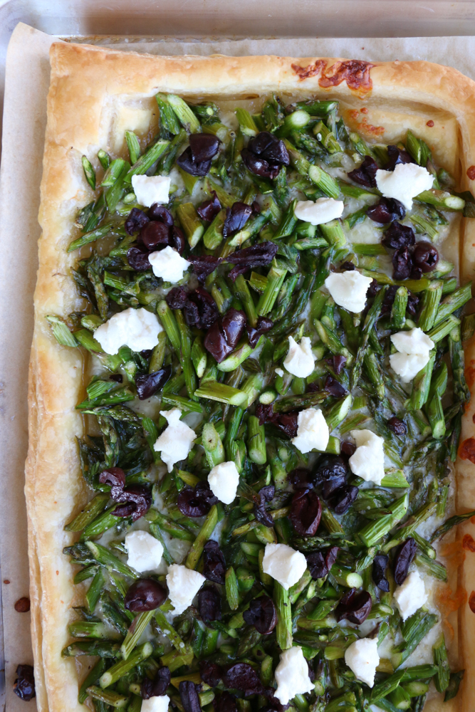 Asparagus Goat Cheese Tart! From America's Test Kitchen and Cook's Illustrated new cookbook, Vegetables Illustrated! Light, flaky and buttery and so much flavor from the asparagus, olives and goat cheese! You're going to love this!&nbsp;