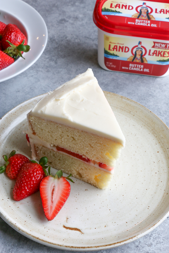 Vanilla Layer Cake with strawberries made with Land O Lakes&reg; Butter with Canola Oil Spread! The perfect spring time treat!