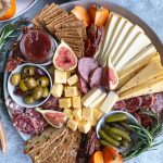 Perfect for parties, the holidays and family gatherings - Making a cheese board is an entertaining essential! #cheeseboard #cheeseplate #holidayparty #hipfoodiemom