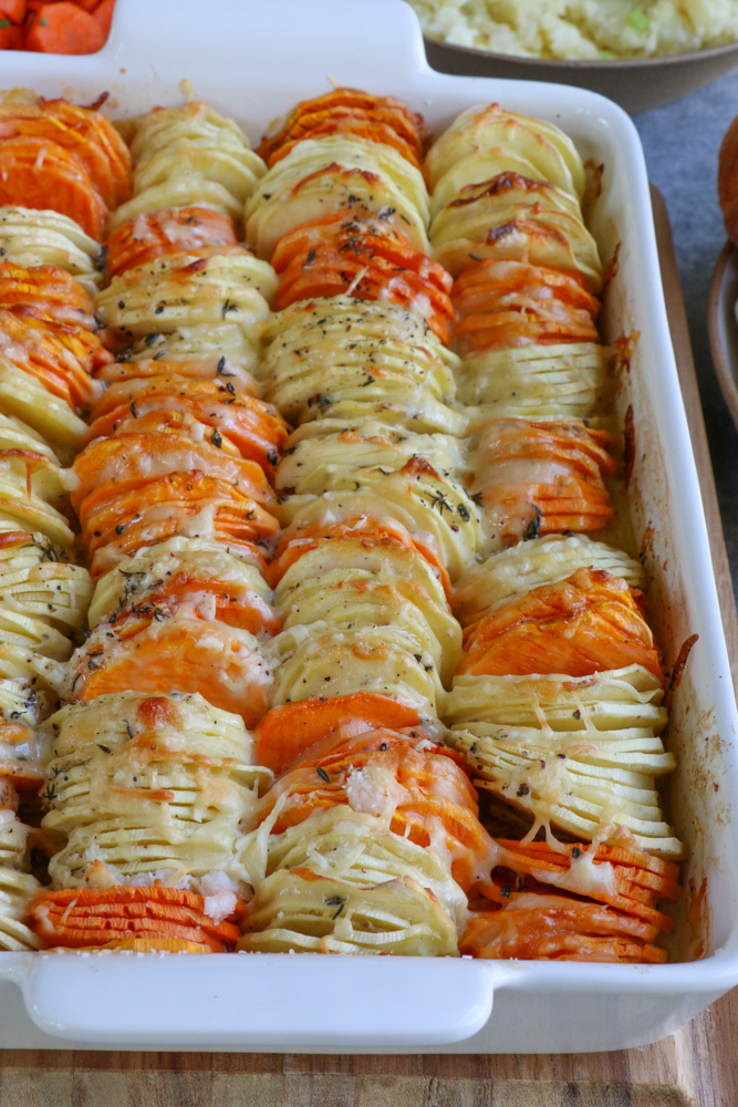 Sweet Potato and Parsnip Gratin! Savory and a delicious blend of sweet potatoes and parsnips, mixed with Gruy&egrave;re and Parmesan cheese and more!