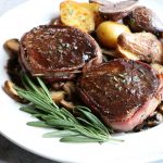 How To Cook Beef Tenderloin at home! Looking for a special recipe to make over the holidays? Wrapped in bacon and with a Pinot Noir sauce!