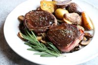 How To Cook Beef Tenderloin at home! Looking for a special recipe to make over the holidays? Wrapped in bacon and with a Pinot Noir sauce!