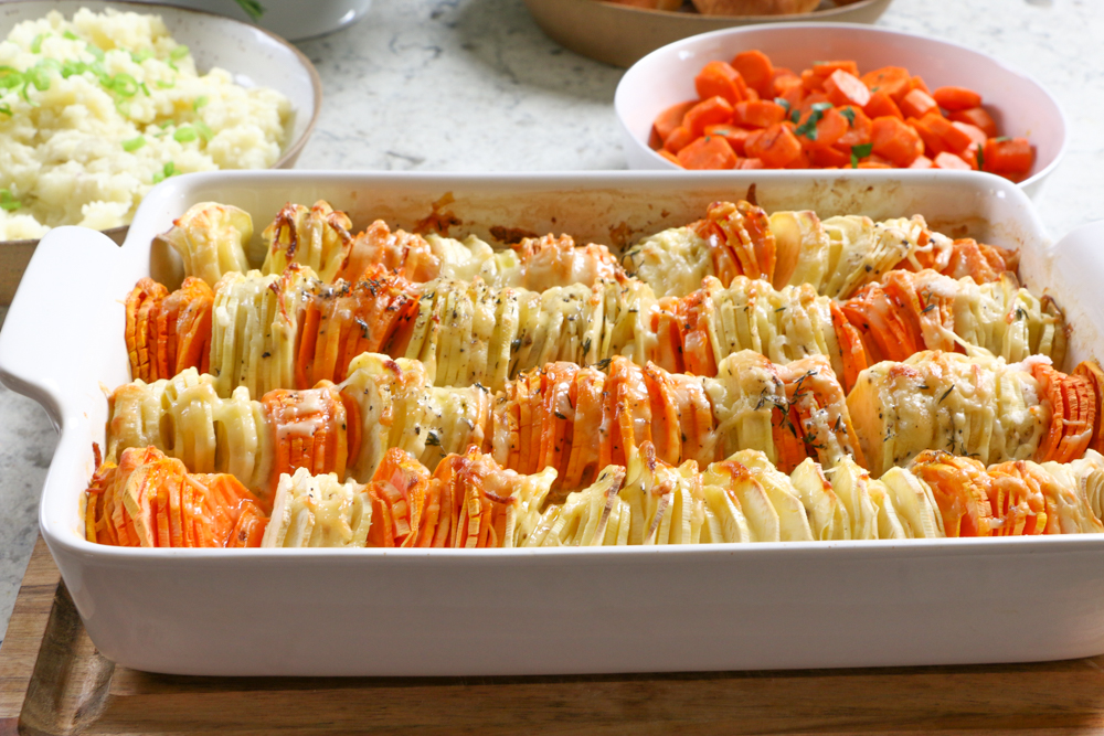 Sweet Potato and Parsnip Gratin! Savory and a delicious blend of sweet potatoes and parsnips, mixed with Gruy&egrave;re and Parmesan cheese and more!