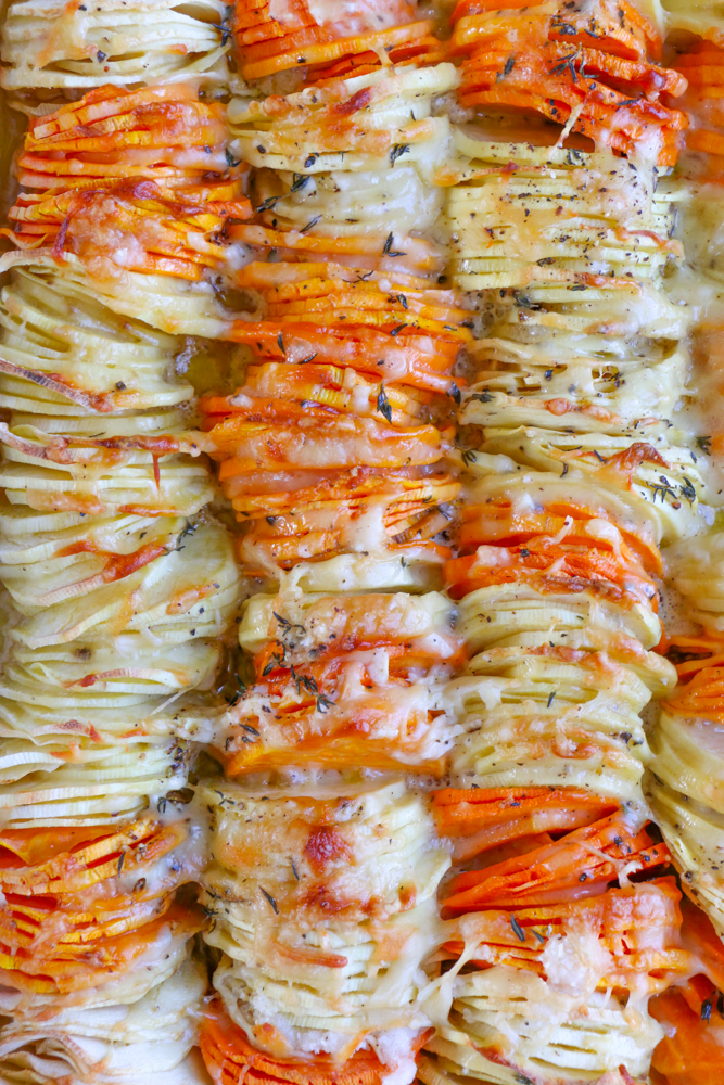 Sweet Potato and Parsnip Gratin! Savory and a delicious blend of sweet potatoes and parsnips, mixed with Gruy&egrave;re and Parmesan cheese and more!