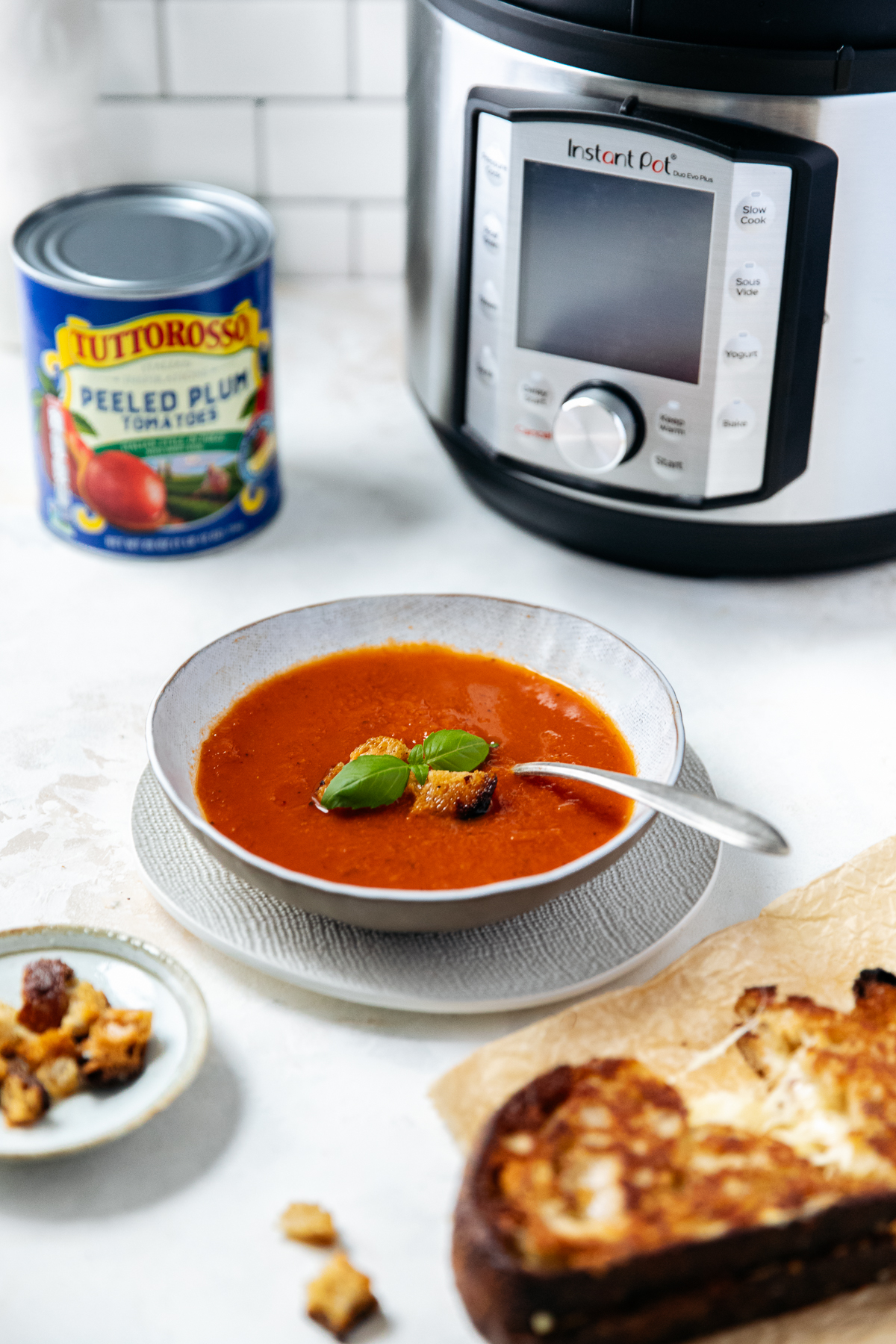Instant Pot Tomato Soup! Classic and delicious Tomato Soup made in a fraction of the time! Rich, creamy and oh so delicious using Tuttorosso Peeled Plum Tomatoes! We hope you try it!