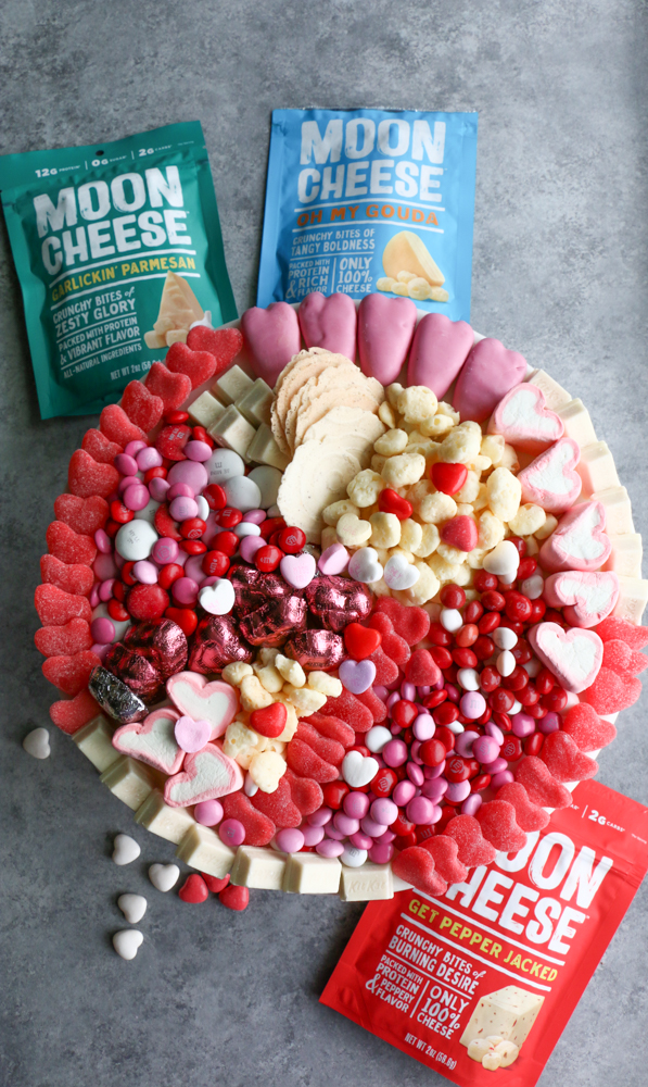 Treating myself a little this Valentine&rsquo;s Day!! This board is filled with all of our favorite things! Can you guess what&rsquo;s on the board? The tiny, crunchy bites of goodness is MOON CHEESE!