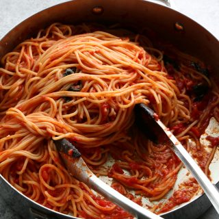 The Best Spaghetti Ever and so easy to make! This recipe uses garlic, olive oil, canned San Marzano tomatoes, butter and more. Make this!