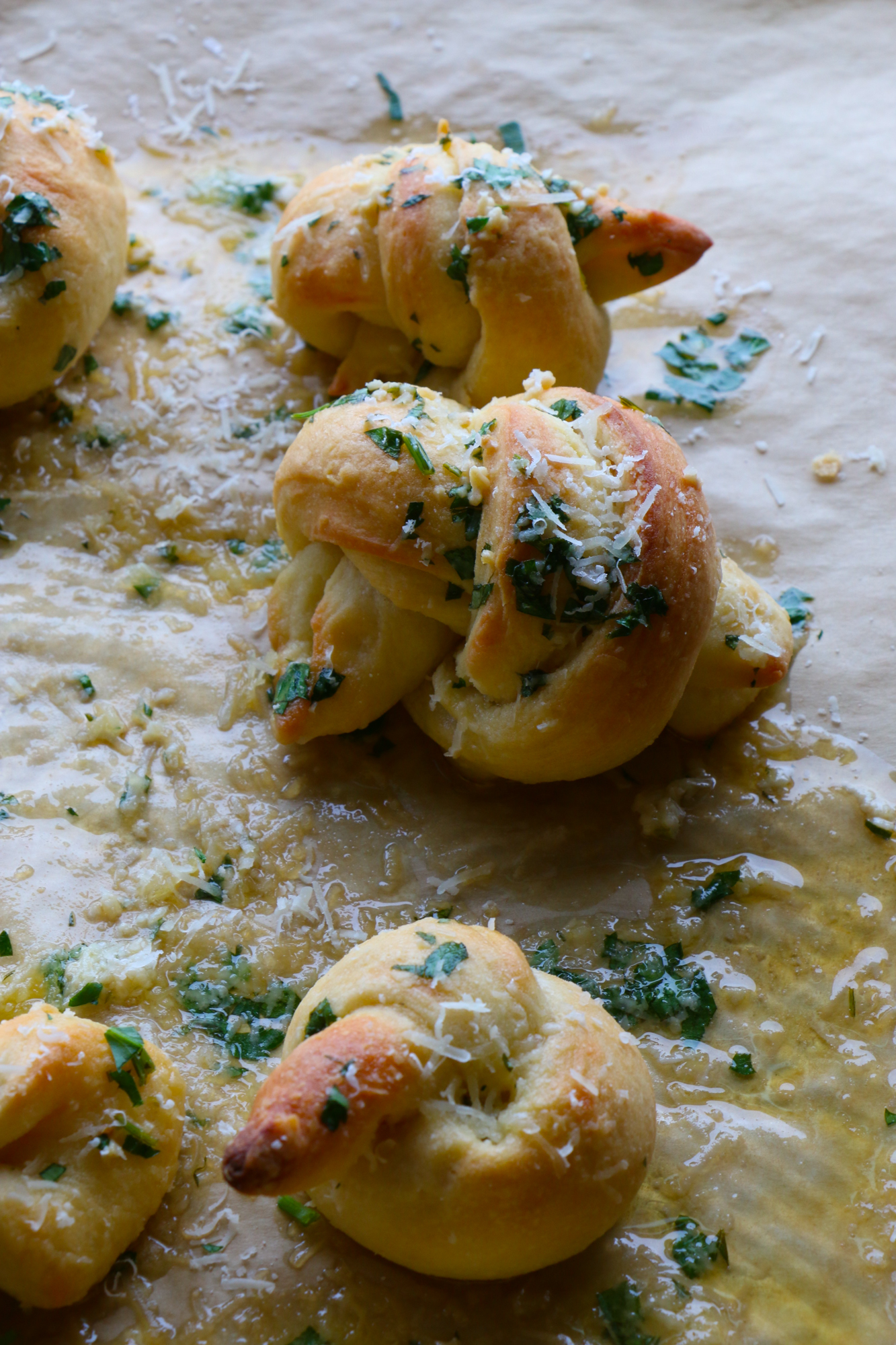 How To Make Parmesan Garlic Knots! So delicious and easy to make! Buttery, garlicky, cheesy goodness. You won't be able to resist these!