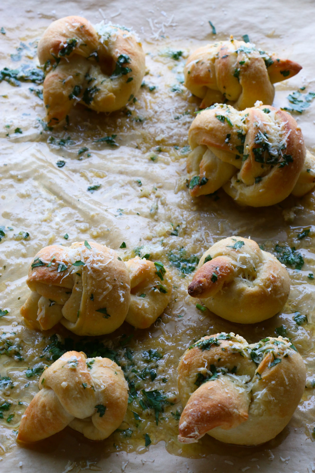 How To Make Parmesan Garlic Knots! So delicious and easy to make! Buttery, garlicky, cheesy goodness. You won't be able to resist these!