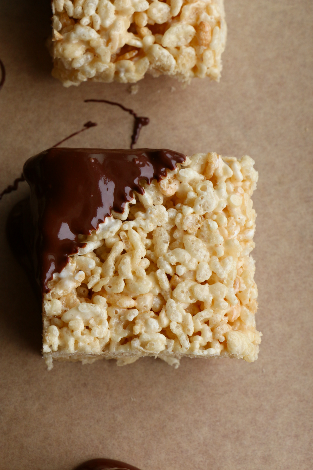 Peanut Butter Rice Krispie Treats with Chocolate! These are so easy to make! Mix it up by adding peanut butter and dipping into chocolate.