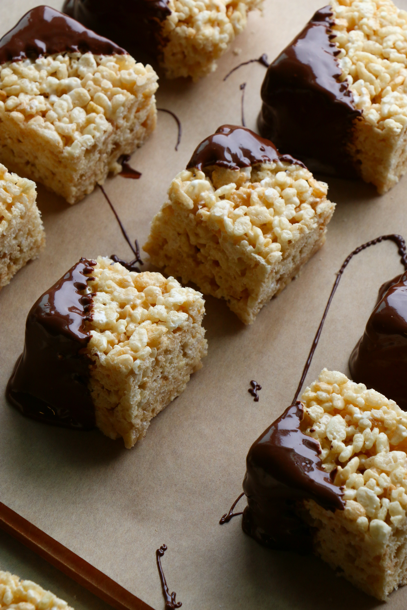 Peanut Butter Rice Krispie Treats with Chocolate! These are so easy to make! Mix it up by adding peanut butter and dipping into chocolate.