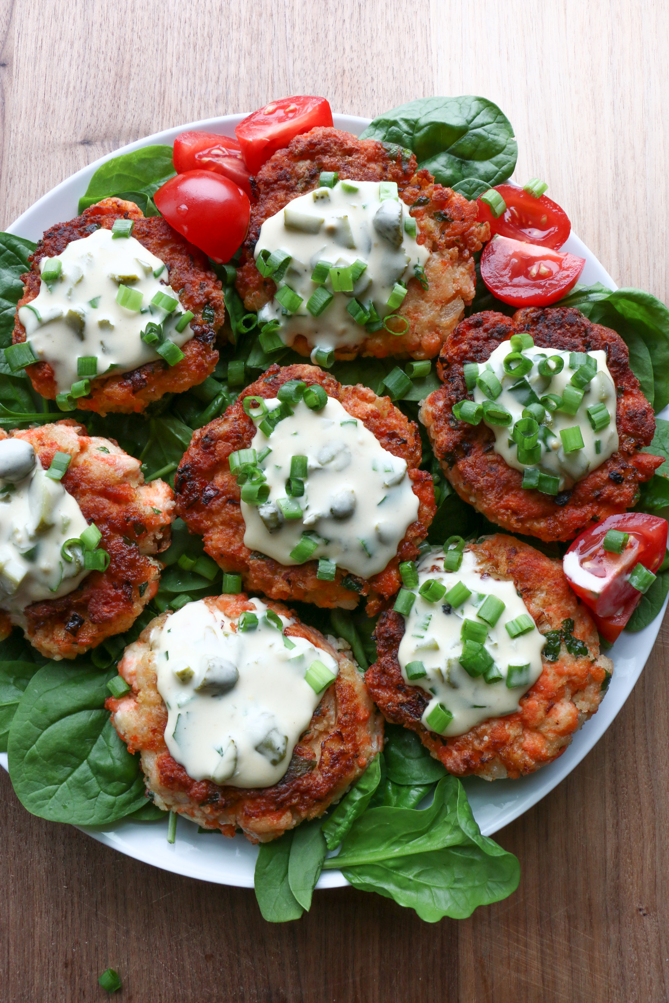 How To Make Salmon Cakes! Delicious and so easy to make! Topped with a homemade tartar sauce, we really hope you try this recipe!