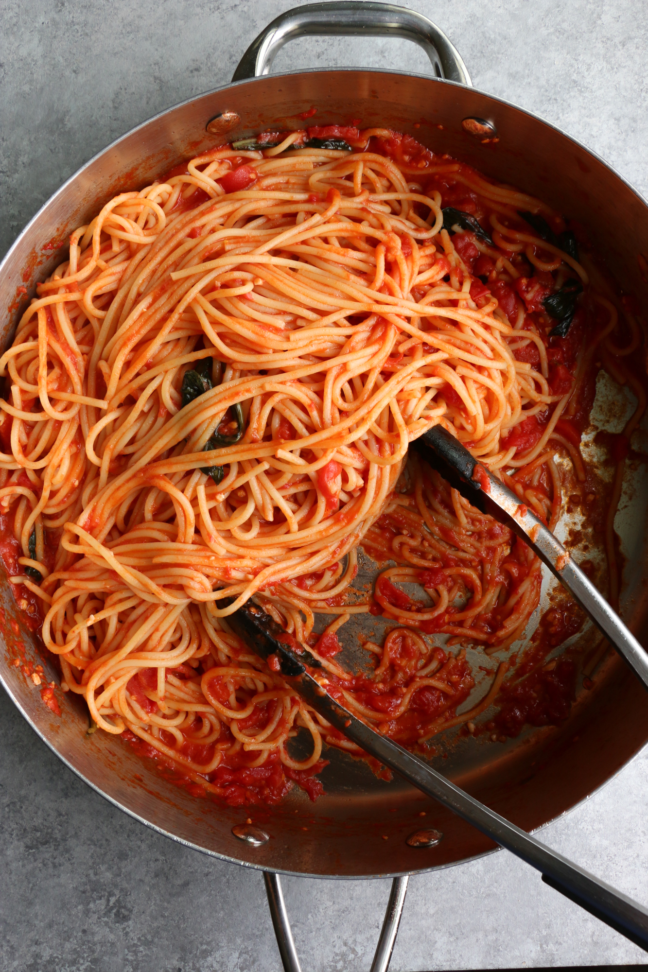 The Best Spaghetti Ever and so easy to make! This recipe uses garlic, olive oil, canned San Marzano tomatoes, butter and more. Make this! 
