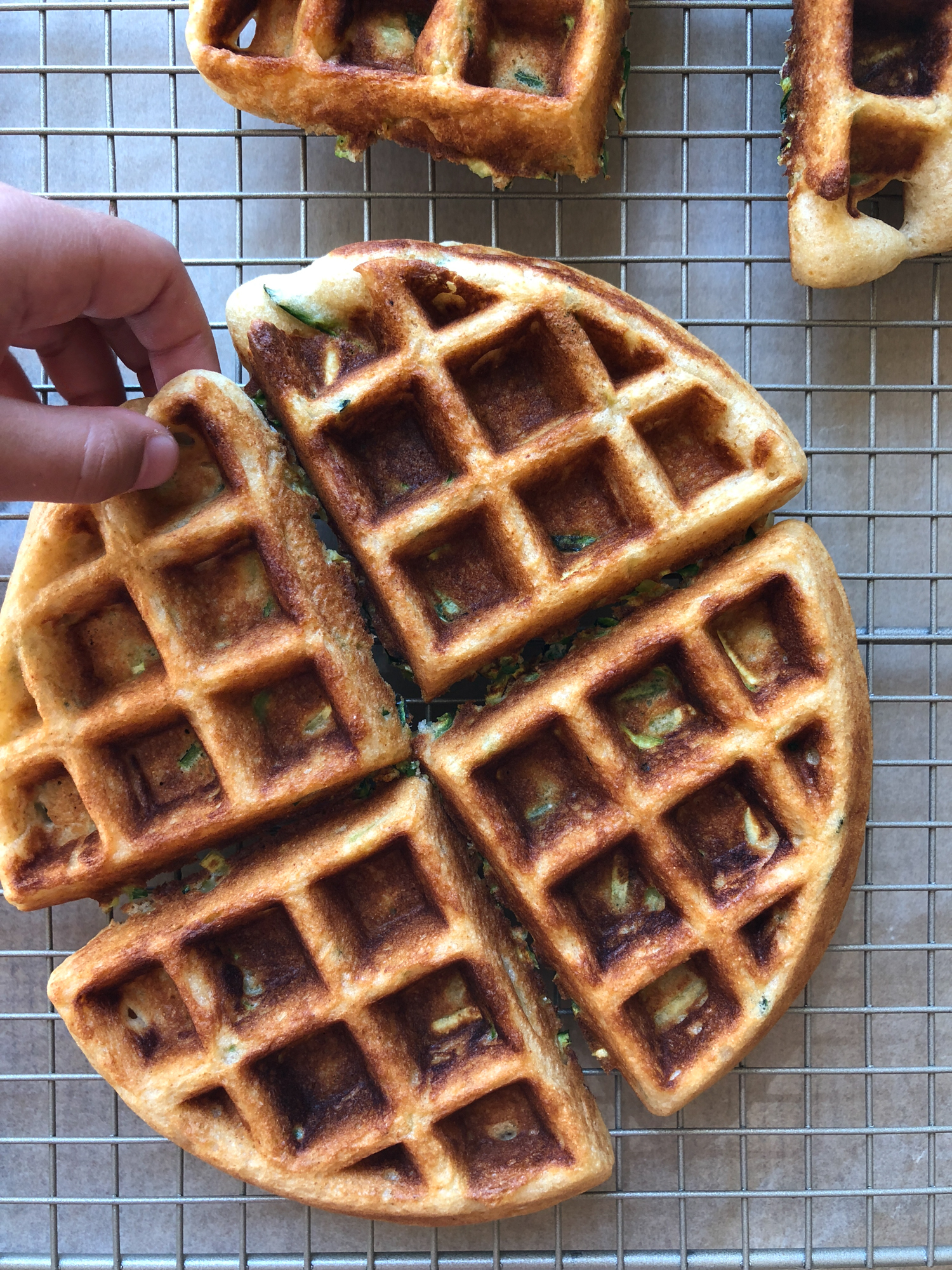 How To Make Zucchini Waffles! A delicious way to incorporate more veggies into your meal! They are so easy to make and THE BEST tasting homemade waffles ever! Don&rsquo;t forget the fresh fruit, butter and maple syrup!