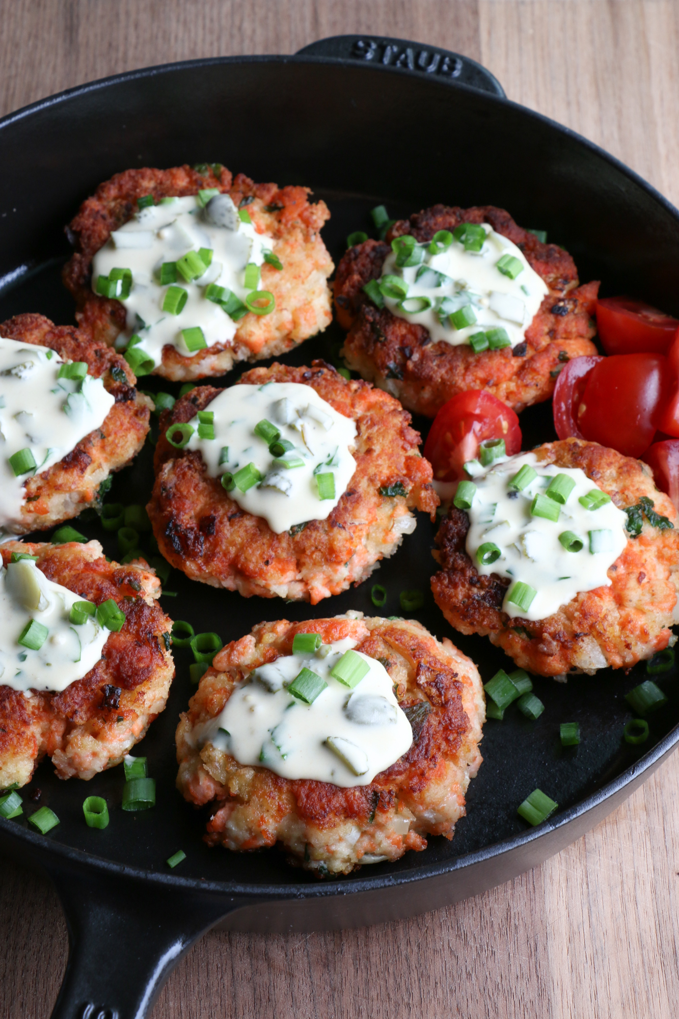 How To Make Salmon Cakes! Delicious and so easy to make! Topped with a homemade tartar sauce, we really hope you try this recipe!