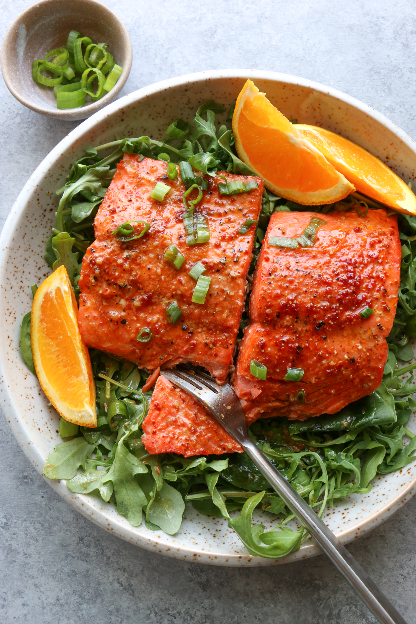 salmon on a bed of greens 
