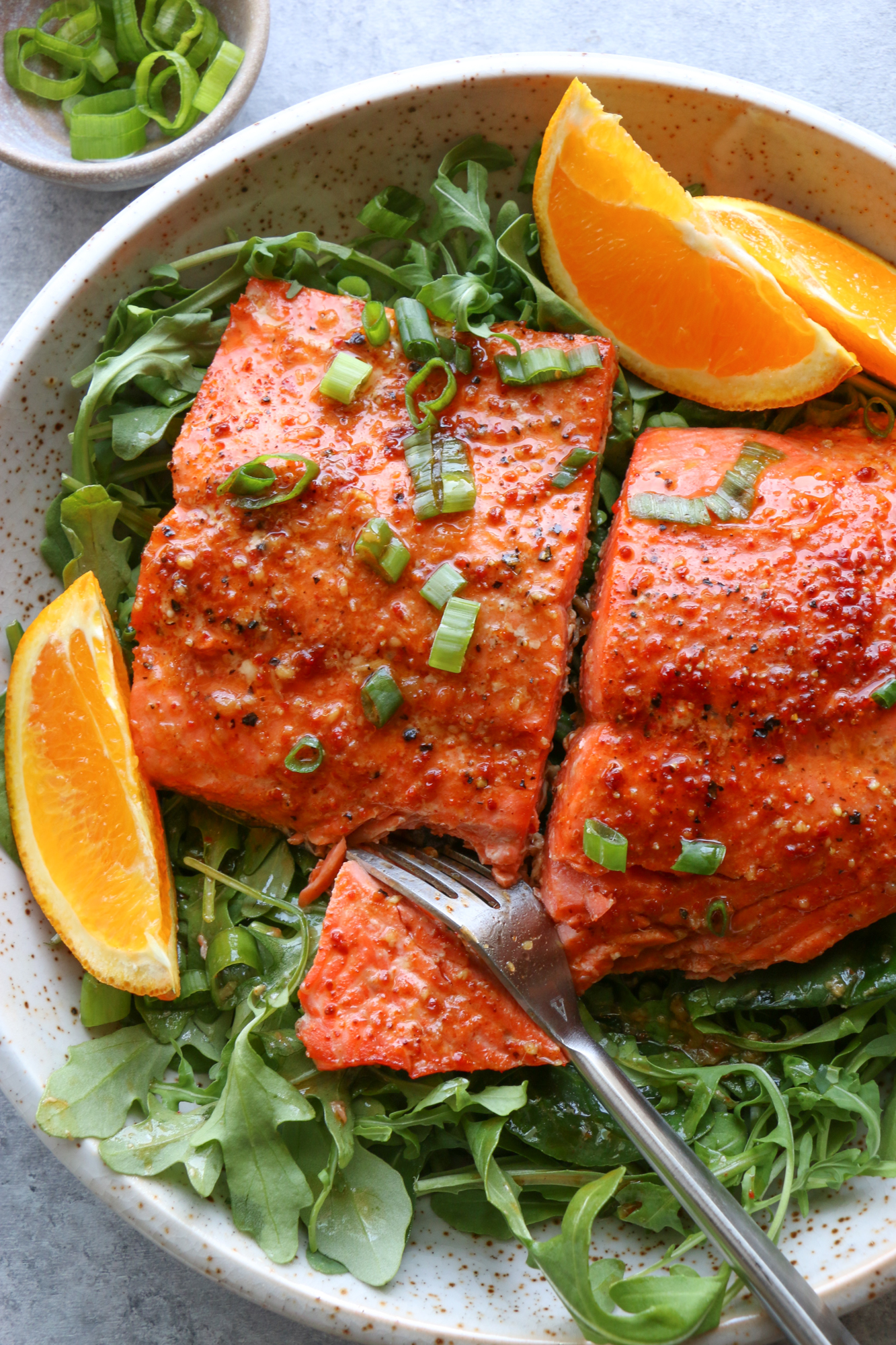 salmon on a bed of greens 