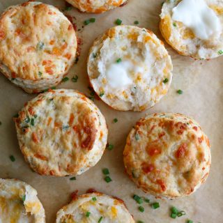 Flaky Cheddar Chive Biscuits! So easy to make and so good! Check out the recipe card below to see the secret for flaky biscuits!