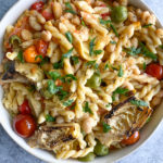 Pasta with Tomatoes and Artichokes! So easy to make! Cook the mini cherry tomatoes until they burst! They are lovely with the garlic and oil.
