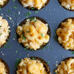 Super Easy Macaroni and Cheese Muffins! Everything you love about macaroni and cheese in muffin form. Cheesy bite sized deliciousness!