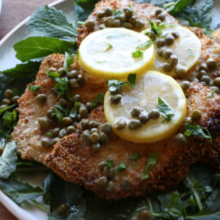 Air Fryer Pork Piccata using no oil at all! Crispy, flavorful and so delicious with a lemon butter caper sauce. It's so delicious!