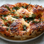 Roasted Honeynut Squash and Kale Pizza made with Food 52’s pizza crust. So incredibly delicious! You have to try it!