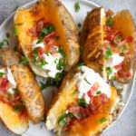 Loaded Baked Potatoes with Bacon and Cheddar!!! So good and so easy to make! This is the best comfort food. Be sure to check out my tips!