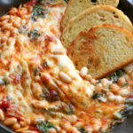Cheesy White Bean Tomato Bake recipe from NY Times Cooking. I made some modifications and have to share this recipe! It's so delicious and quite addicting!