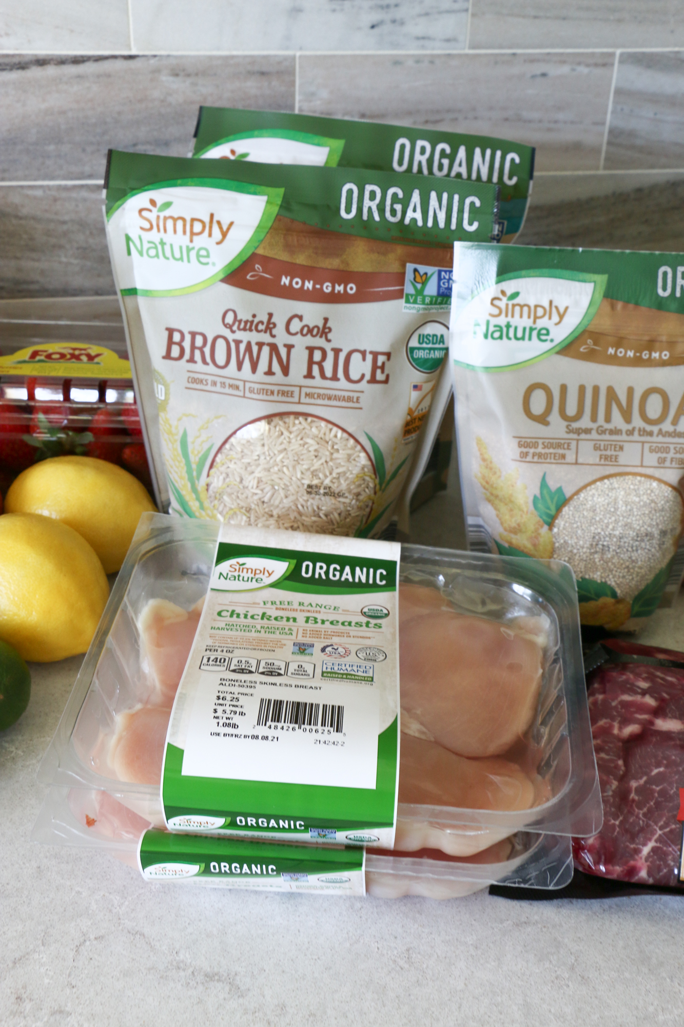 Make Ahead Meals with ALDI: Marinated Flat Iron Steak and chicken with brown rice, quinoa and steamed vegetables.