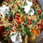 Spaghetti with Ricotta and Tomatoes! Creamy, flavorful and so delicious! This one comes together in under 30 minutes and is absolutely delicious. The ricotta makes the pasta creamier and the pesto takes the entire dish up a notch in my opinion. Mix everything together and it's heaven. Hope you try it!